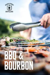 A person uses tongs to grill meat outdoors, food in focus and a blurred background. The text PEACH STREET DISTILLERS BBQ & BOURBON and PSD Single Post are displayed prominently on the image.