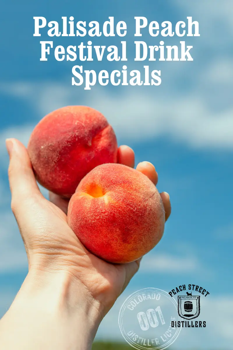 A hand holding two ripe peaches against a blue sky, with text promoting Drink Specials for the Palisade Peach Festival and the Peach Street Distillers logo.